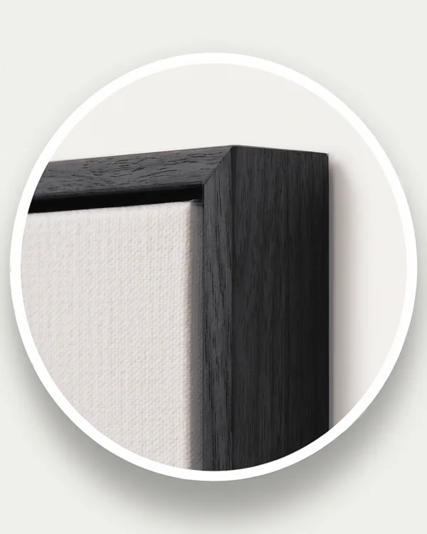 Close-up of the black floating frame, the canvas texture and the gap between them