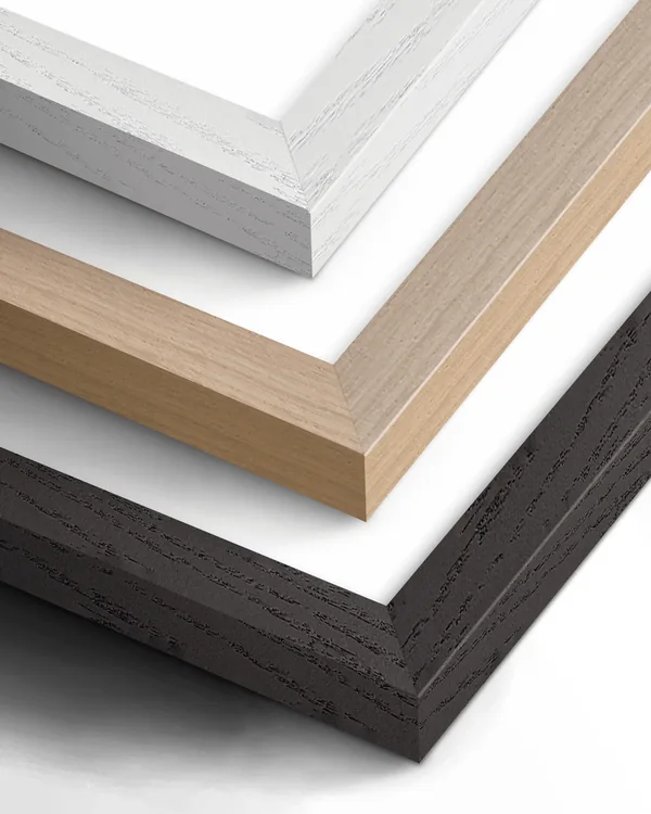 Close-up of the white, natural wood and black frame corners